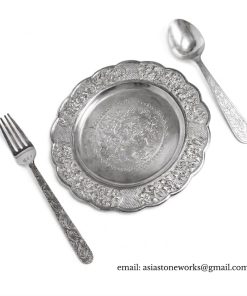 A set of dishes, spoons, and plates made from silver